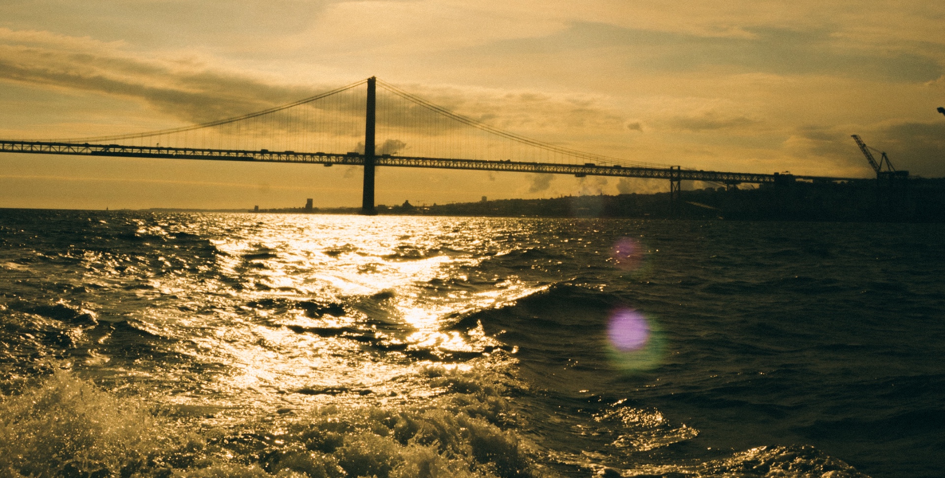 Luxury wooden yacht on the Tagus at sunset